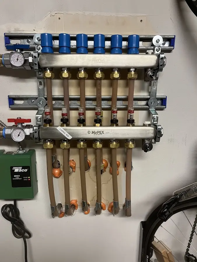 Plumber performing Water Heater Repair at a residential property in Bloomfield Hills